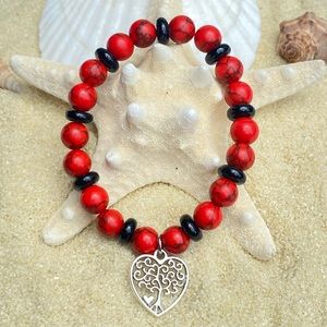Beaded bracelet - red howlite, black obsidian and silver tone charm